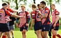 CELEBRATION TIME . . . (right group) Jack Taylor, Josh Watson, Jordan McEwan and Charlie Roscoe enjoy a try