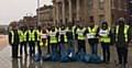 AHMADIYYA Muslims Youth Association members clean up the town centre