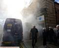 SMOKE signals . . . the moment a security van is targeted outside Barclays in Shaw