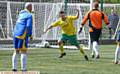 GET IN . . . Town's Wayne Dean scores an early goal
