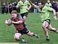 DIVING IN . . . Jake O'Grady, of Waterhead, reaches for the line against West Bowling.