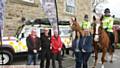 SHOWCASE . . . from left, Saddleworth parish councillor Jamie Curley, Dr Dave Taylor, David Knight, both from Oldham Mountain Rescue, Jane Soriente, Christine Wilson with PC Kate Guest on Bumble, and PC John Bradshaw on Tangle