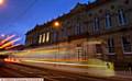 A Metrolink tram running past Oldham Lyceum