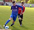 ACTION STATIONS . . . Crown's Joe McNamara shields the ball from Limeside's Joe Heap