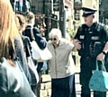 VILLAGE bobby Lee Cullen helps an elderly villager in Uppermill