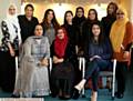 BARONESS Uddin, (seated middle front row), along with invited guests