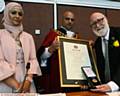 PRESENTATION . . . New Mayor and Mayoress Councillor Shadab Qumer and his wife Sobia Arshi, with retiring mayor Councillor Derek Heffernan. Right: Retiring mayoress Di Heffernan
