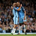 CITY stars Vincent Kompany (right) and Pablo Zabaleta embrace