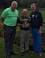 COMMITTEE Cup winner Roy Dobson (centre) flanked by president Dave Pullen (left) and captain Dean Jagger