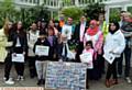 THE Alexandra Park peace vigil included a presentation made to the former Mayor Cllr. Derek Heffernan (seated, centre) for his work as Oldham's Champion for Peace.
