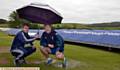 RAIN, RAIN, GO AWAY . . . captains Ryan Barnes (Heyside, left) and Glodwick's Nigel Stock. 