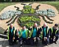 TEAM effort . . . Howard Wild, Tony Shirtcliffe, Marcus Davies, Stephen Parrot and Kyle Stokes, from Chadderton Garden Team, who created the Manchester Bee flower bed outside the town hall
