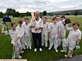 YOUTH AND EXPERIENCE . . . . John Punchard, who will play in this summer's over-60s Ashes series, with his Crompton under-11s team at Glebe Street