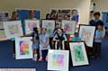 PUPILS at Kingfisher Special School with some of their art work framed for the Colour Pop gallery exhibition, to raise money for the school's hydrotherapy pool. Back left to right, Diane Molden (teaching assistant), Nic Found (director of creative learning), Muna Inam, Chelsea Beards (teaching assistants.), Michelle Flye (teacher). Front left to right, Aishah Irfan, Daisy Hampson, Thomas Wilshaw, Phoenix Knight, Imama Noor and Jayden Mack-Purcell