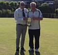 ALL YOURS . . . Gary Ellis (right) receives the GM Merit trophy from GM deputy president Nigel Fryer