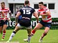 I'VE GOT MY EYES ON YOU . . . Luke Adamson looks to sidestep a Swinton Lions defender