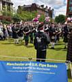 EMOTIONAL . . . Pipe bands play in Piccadilly Gardens to pay tribute to the victims