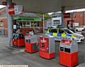 SCENE of robbery . . . Police at the Co-Op filling station at Lees