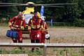 MEDICS dash from the helicopter air ambulance which touched down in Oldham town centre