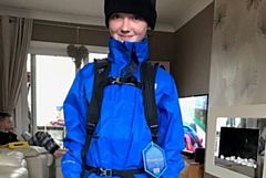 Luke De La Haye tries on his waterproof clothes ahead of his Mount Snowdon Challenge