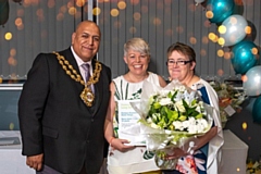 Pippa and Helen receieve their 10-year fostering award from the Mayor of Oldham, Councillor Javid Iqbal