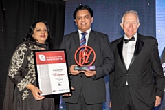 Oldham's Dr Zahid Chauhan (centre) receives his Homeless Friendly award