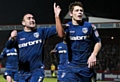 James Tarkowski (right) celebrates a 2013 goal during his time with Athletic