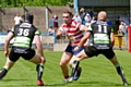 Oldham's former Halifax man Jack Spencer (centre)