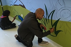 Local artist Javed Saddique pictured at the Royal Oldham Hospital