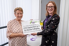 First Choice Homes Oldham Board member Bernie Callaghan officially opens the new site alongside the company's Assistant Director (Property Care) Siobhan McCoy