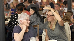 Diners chat at Mossley SOUP