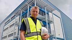 Adam Sedgwick of Edge Structural Design at Haydock Green in front of balcony steelwork at the warehouse reception.