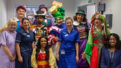 The cast of Jack and the Beanstalk with staff at Dr Kershaw's Hospice