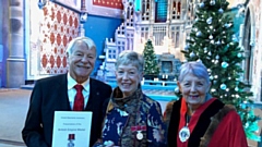 Jennifer Greenwood, centre, with Her husband Chris and Oldham’s deputy mayor, Cllr Jenny Harrison,  pictured at the BEM ceremony.