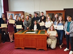 Pictured are (left to right): Caitlin, Megan, Vicky, Eleonore, Aisling, MP Debbie Abrahams, Zeshan, Cllr Ginny Alexander, Archie, Lisa, Tom, Katie, Jenna, Emily, Freya, Libby and Aman