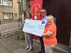 Cheque mates: Pictured are Rev Audrey Lee and Hilary Yates from Ebenezer, and Adrian Green of Uppermill Methodist Church