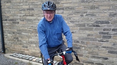 Rev John Rosedale on his bike 
