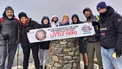 The dedicated team pictured after their gruelling fundraising walk to the top of Mount Snowdon