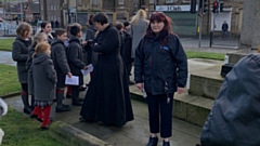 People gather at the Crompton War Memorial 