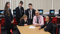 Saddleworth school executive headmaster Matthew Milburn with some of his senior students.