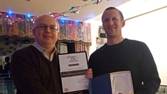 Cllr Jamie Curley, left, seen presenting the coveted Above and Beyond award to Rob Tortoishell, OMRT leader, late last year