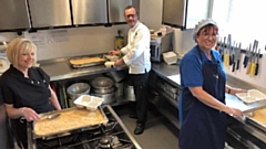 Pictured, from the left: Julie Hey, Head Chef at Age UK, Mike Shaw, Chef from the White Hart and Yvonne Green, Age UK Supervisor portioning up the fish pie in the Link Centre kitchen