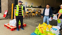 Oldham's Ahmadiyya Muslim Community volunteers are pictured preparing the food parcels