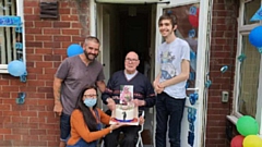 Elijah is pictured with grandson Martin, great grandson Charlie and caregiver Claire