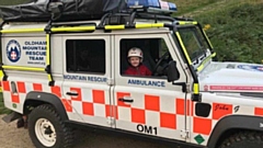 Youngster Henry is pictured in an Oldham Mountain Rescue Team vehicle