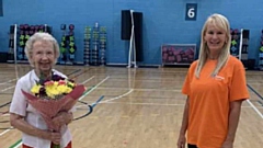 Violet Walpole is pictured with her birthday bunch of flowers