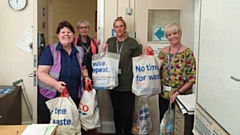 Rose Knipe is pictured (left) with some of her kind-hearted Tesco colleagues last year