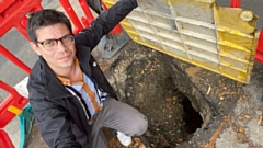 Councillor Sam Al-Hamdani pictured at the scene of the hole in the street