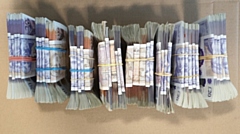 Some of the cash seized during police raids