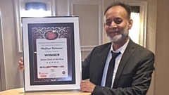 Mofizur Rahman proudly shows off his award